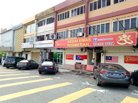 kedai emas ros merah photos